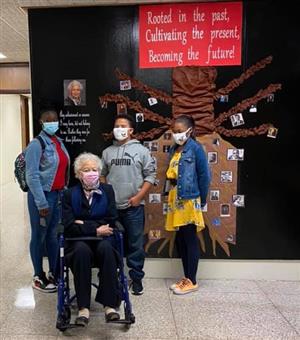 Dr. Holloway-Young standing with students